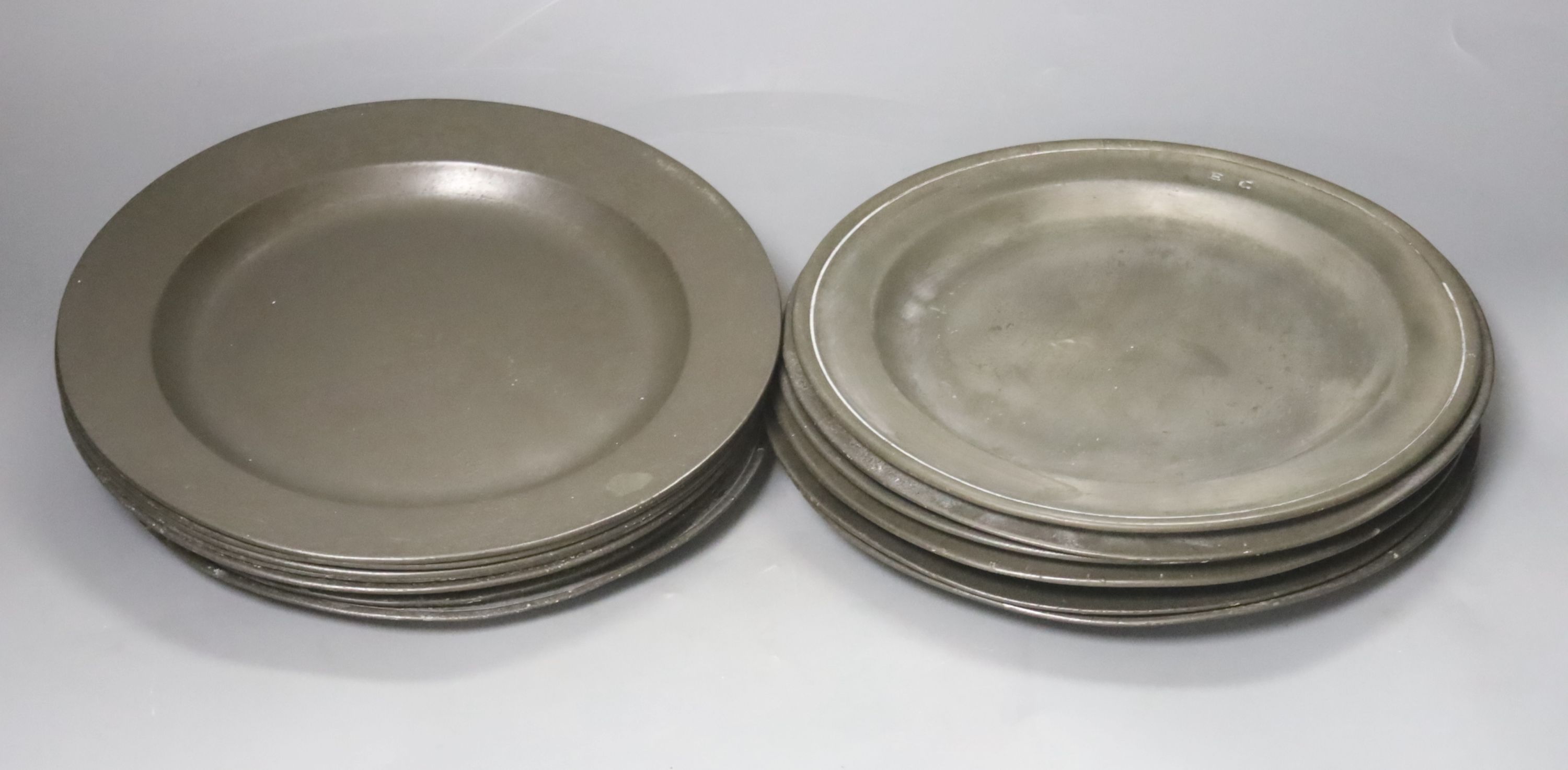 A quantity of 18th century pewter plates, London touch marks diameter 24cm